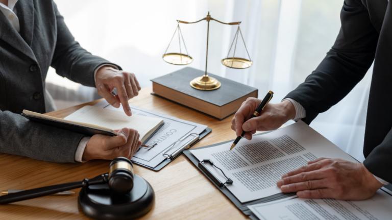 Two people going over contracts