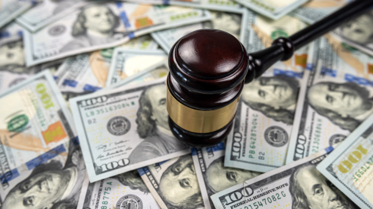 Gavel with money under it