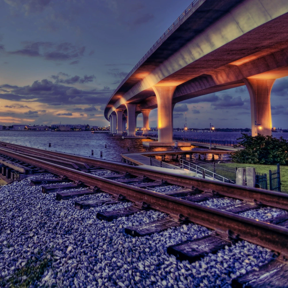 Roosevelt Bridge and railroad tracks at sunset in Stuart, Florida