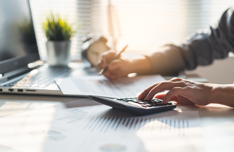 Businessman calculating business balance