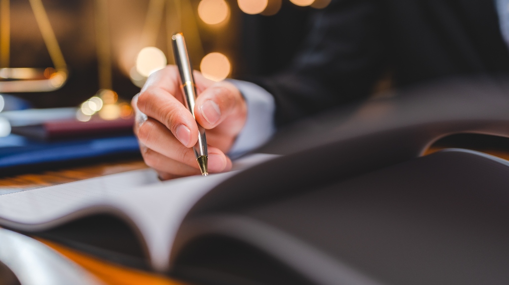 lawyer is signing documents